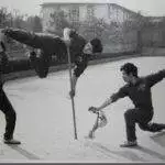 Dr. Tan practicing martial arts with his team members (1983)