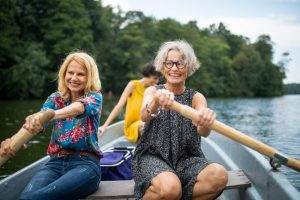 Women rowing a boat together